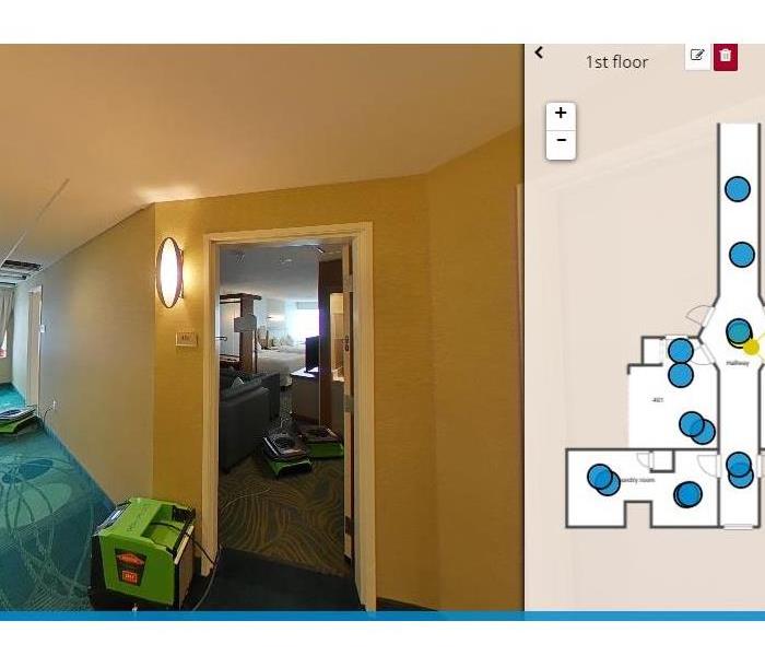 Image description: image of a hotel hallway and room with servpro air movers and a sketch of the affected area on the right