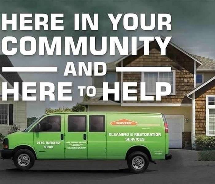 SERVPRO truck with saying, "Here in Your Community. Here to Help"