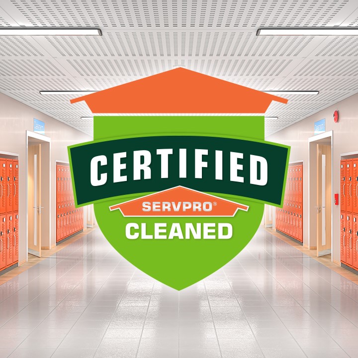 lockers of a school in background with SERVPRO Certified Cleaned Shield logo in foreground